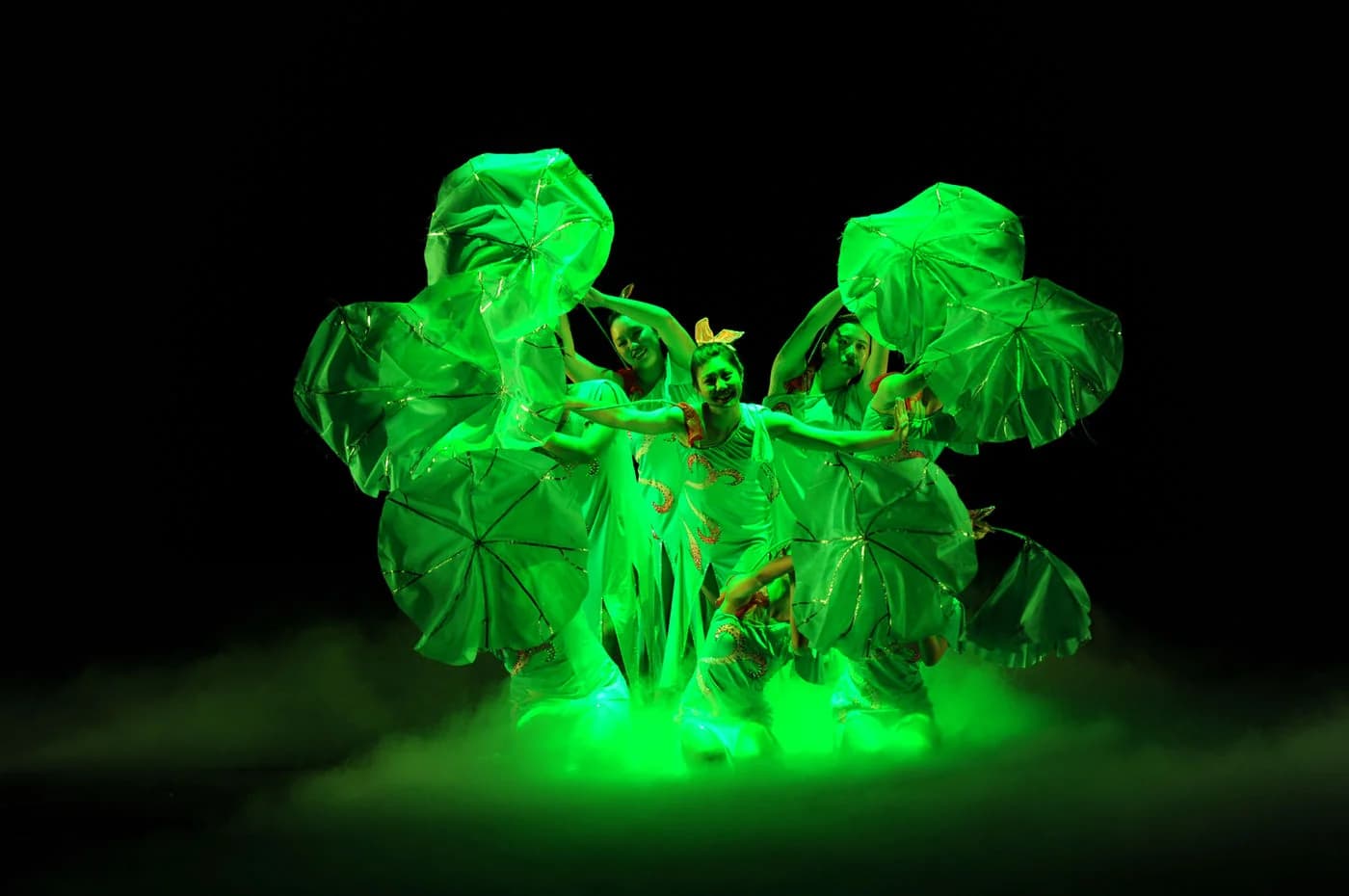 Chinese folk dance performance in green light